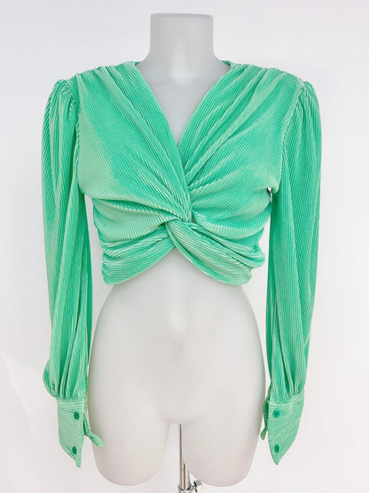 Blusa plisada con nudo frontal